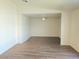 Spacious living room with ceiling fan and neutral tones at 5406 Indigo Hills St, North Las Vegas, NV 89031