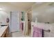 Bright bathroom featuring a glass-enclosed shower and neutral-toned tiling at 5717 Calm Lagoon Ave, Las Vegas, NV 89130