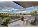 Balcony with seating area and views of the golf course and blue skies at 60 Innisbrook Ave, Las Vegas, NV 89113
