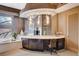 Bathroom with vanity, tub, and decoratively framed vanity mirror and overhead lighting at 60 Innisbrook Ave, Las Vegas, NV 89113