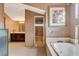 Open bathroom layout featuring a soaking tub, separate shower, and vanity area at 60 Innisbrook Ave, Las Vegas, NV 89113