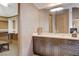 Bathroom showcasing vanity with granite countertop and dark wood cabinets at 60 Innisbrook Ave, Las Vegas, NV 89113