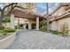 Elegant home featuring a grand entrance and a spacious driveway with pavers at 60 Innisbrook Ave, Las Vegas, NV 89113