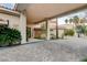 Inviting entryway with a porte cochere and lush landscaping, providing a warm welcome at 60 Innisbrook Ave, Las Vegas, NV 89113