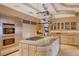 Open-concept kitchen with stainless steel appliances, granite countertops and center island with cooktop at 60 Innisbrook Ave, Las Vegas, NV 89113