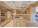 Spacious kitchen features stainless steel appliances, granite countertops and a large island with cooktop at 60 Innisbrook Ave, Las Vegas, NV 89113