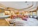 Expansive living room with open layout, modern furniture, and backyard views at 60 Innisbrook Ave, Las Vegas, NV 89113