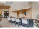 Elegant living room featuring a stylish bar area with seating and modern decor at 60 Innisbrook Ave, Las Vegas, NV 89113