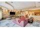Open-concept living room with a modern fireplace, stylish furniture, and great lighting at 60 Innisbrook Ave, Las Vegas, NV 89113