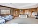 Expansive main bedroom features a sitting area, neutral tones, and a cozy, carpeted floor at 60 Innisbrook Ave, Las Vegas, NV 89113