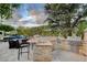 Outdoor kitchen with stainless steel grill and dining area at 60 Innisbrook Ave, Las Vegas, NV 89113
