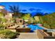 Resort-style backyard pool with a covered cabana and dining table with comfortable seating at 60 Innisbrook Ave, Las Vegas, NV 89113