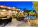 Resort-style backyard pool with a covered cabana and dining table with comfortable seating at 60 Innisbrook Ave, Las Vegas, NV 89113