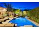 Resort-style backyard pool with a covered cabana and dining table with comfortable seating at 60 Innisbrook Ave, Las Vegas, NV 89113