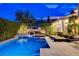 Stunning backyard pool area with comfortable lounge seating and lush landscaping at 60 Innisbrook Ave, Las Vegas, NV 89113