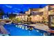 A covered cabana and lounge chairs flank this outdoor pool and spa at 60 Innisbrook Ave, Las Vegas, NV 89113