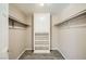 Walk-in closet with built-in shelving and hanging rods to maximize storage space at 6151 Whispering Sands Dr, Las Vegas, NV 89131