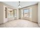 Bright dining room with multiple windows overlooking the property's exterior landscaping and natural light at 6151 Whispering Sands Dr, Las Vegas, NV 89131