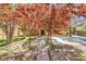 Attractive home with a brick pathway, mature trees, and well-maintained landscaping at 6151 Whispering Sands Dr, Las Vegas, NV 89131