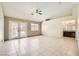 Bright open living room with french doors and bathroom access at 6151 Whispering Sands Dr, Las Vegas, NV 89131