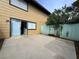 Concrete patio area with backyard access and sliding glass door at 6174 Meadowgrass Ln, Las Vegas, NV 89103