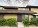 Inviting two-story townhouse with a well-maintained exterior and landscaped front yard at 6174 Meadowgrass Ln, Las Vegas, NV 89103