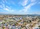 Elevated view of a thriving neighborhood with diverse homes, verdant trees, and mountain vistas in the distance at 6635 Laredo St, Las Vegas, NV 89146