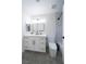 Bright bathroom featuring a modern vanity with gold hardware and a sleek, updated design at 6655 Tranquil Seas Ct, Las Vegas, NV 89139