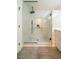 This bathroom features a sleek, updated, marble shower with black hardware at 6655 Tranquil Seas Ct, Las Vegas, NV 89139