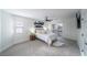 This stylish bedroom is brightly lit with carpeted floors and stylish decor at 6655 Tranquil Seas Ct, Las Vegas, NV 89139