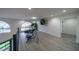 Spacious bonus room featuring modern exercise equipment, arch window, and stylish flooring at 6655 Tranquil Seas Ct, Las Vegas, NV 89139