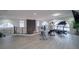 Bright bonus room with exercise equipment, arch windows, and view of the living room below at 6655 Tranquil Seas Ct, Las Vegas, NV 89139