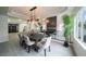 Stylish dining area with modern lighting and railing overlooking the entry way at 6655 Tranquil Seas Ct, Las Vegas, NV 89139