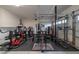 Spacious home gym featuring a variety of weightlifting equipment and rubber flooring at 6655 Tranquil Seas Ct, Las Vegas, NV 89139