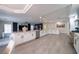 Spacious open-concept kitchen boasting stainless steel appliances, white cabinets, and expansive countertops at 6655 Tranquil Seas Ct, Las Vegas, NV 89139