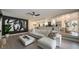 Open concept living room with white sectional sofa and view to the kitchen at 6655 Tranquil Seas Ct, Las Vegas, NV 89139