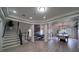 Spacious living room with a pool table, fireplace, and dining area at 6655 Tranquil Seas Ct, Las Vegas, NV 89139