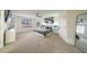 Large primary bedroom with ample natural light, ceiling fan, and modern furnishings at 6655 Tranquil Seas Ct, Las Vegas, NV 89139