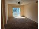 Bedroom with a ceiling fan and a sliding glass door at 6955 N Durango Dr # 2107, Las Vegas, NV 89149