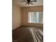 Bedroom with neutral carpet, a ceiling fan and a window at 6955 N Durango Dr # 2107, Las Vegas, NV 89149