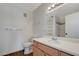 Bright bathroom features a single sink vanity with a large mirror and a shower over tub combo at 7885 W Flamingo Rd # 2012, Las Vegas, NV 89147