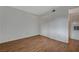 An unfurnished bedroom with wood-look flooring, closet and neutral paint at 7885 W Flamingo Rd # 2012, Las Vegas, NV 89147