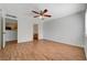 A bright, spacious bedroom with wood-look flooring, a ceiling fan, and natural light from the window at 7885 W Flamingo Rd # 2012, Las Vegas, NV 89147