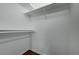A walk-in closet is neatly organized with shelves and rods for storage solutions at 7885 W Flamingo Rd # 2012, Las Vegas, NV 89147