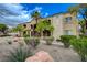 This multi-story condo features well-maintained landscaping, balconies, and desert rock groundcover at 7885 W Flamingo Rd # 2012, Las Vegas, NV 89147