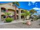 A condo exterior with a staircase and multiple balconies featuring well-maintained landscaping at 7885 W Flamingo Rd # 2012, Las Vegas, NV 89147