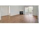 Cozy living space boasting a fireplace, wood floors, and a glass door to a private balcony at 7885 W Flamingo Rd # 2012, Las Vegas, NV 89147