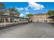 Exterior view of the community showing covered parking spaces and well-maintained landscaping at 7885 W Flamingo Rd # 2012, Las Vegas, NV 89147