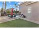 Expansive backyard features lush turf, a sparkling pool, and ample patio space for outdoor entertaining at 8433 Honeywood Cir, Las Vegas, NV 89128