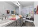 Bathroom featuring a double sink and turtle themed decor at 8433 Honeywood Cir, Las Vegas, NV 89128